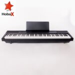Дигитално пиано HOBAX S-192, 88 клавиша, HAMMER ACTION тежка клавиатура 7 октави, 8 звуци, 128 ритми, стойка за ноти, SUSTAIN педал + 3 ПОДАРЪКА - слушалки, стикери за клавиши и покривало