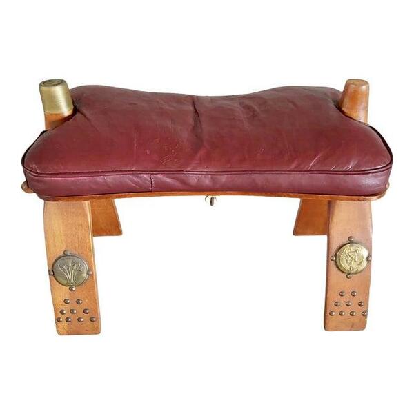 https://cdncloudcart.com/25184/products/images/1029/vintage-leather-camel-saddle-ottoman-stool-footstool-with-leather-cushion-image_60e015951318f_600x600.jpeg?1653462273