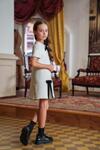 Бяла детска рокля с черни панделки от кадифе